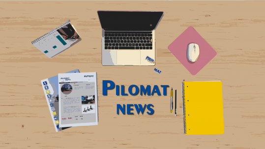 Pilomat News image showing a desk and the tools of the editor: laptop, calendar, papers and pen