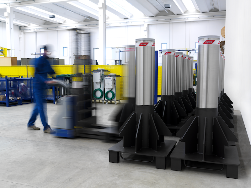 Image showing a worker moving some fixed bollards by means of a forklift