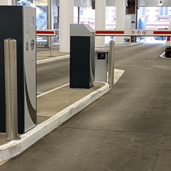 Fixed design stainless steel bollards in a car parking