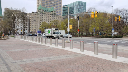 Image of fixed bollards installed to protect a square from the road traffic