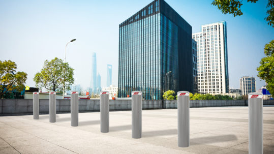 Image of several high security fixed bollards in a row, installed in the city center for protecting a pedestrian area