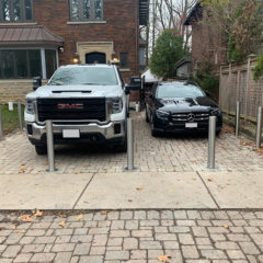 image of many stainless steel bollards E-GO installed to protect the parking lot